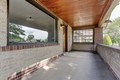 Relax on the covered front porch, looking north