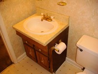 Hall Bathroom Vanity With Brass Faucett